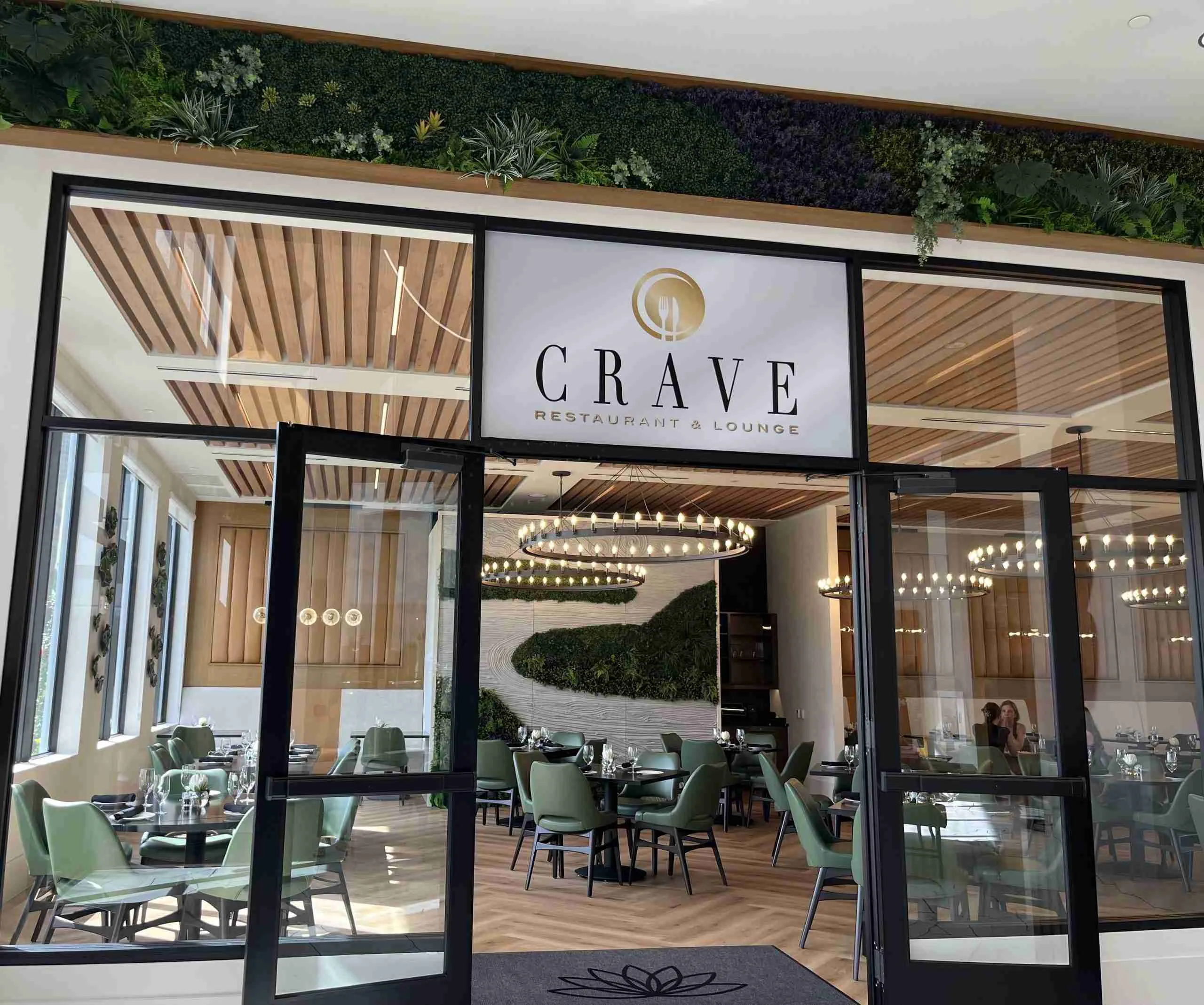 Crave Restaurant at Lotus Palm exterior with elegant dining setup in Boca Raton