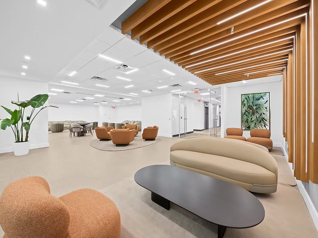 10th Floor Town Hall Amenity Lounge interior with modern furnishings and wood beam ceiling